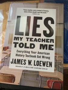 Explain the two approaches that Loewen says guide college courses and textbooks when analyzing U.S. actions overseas.